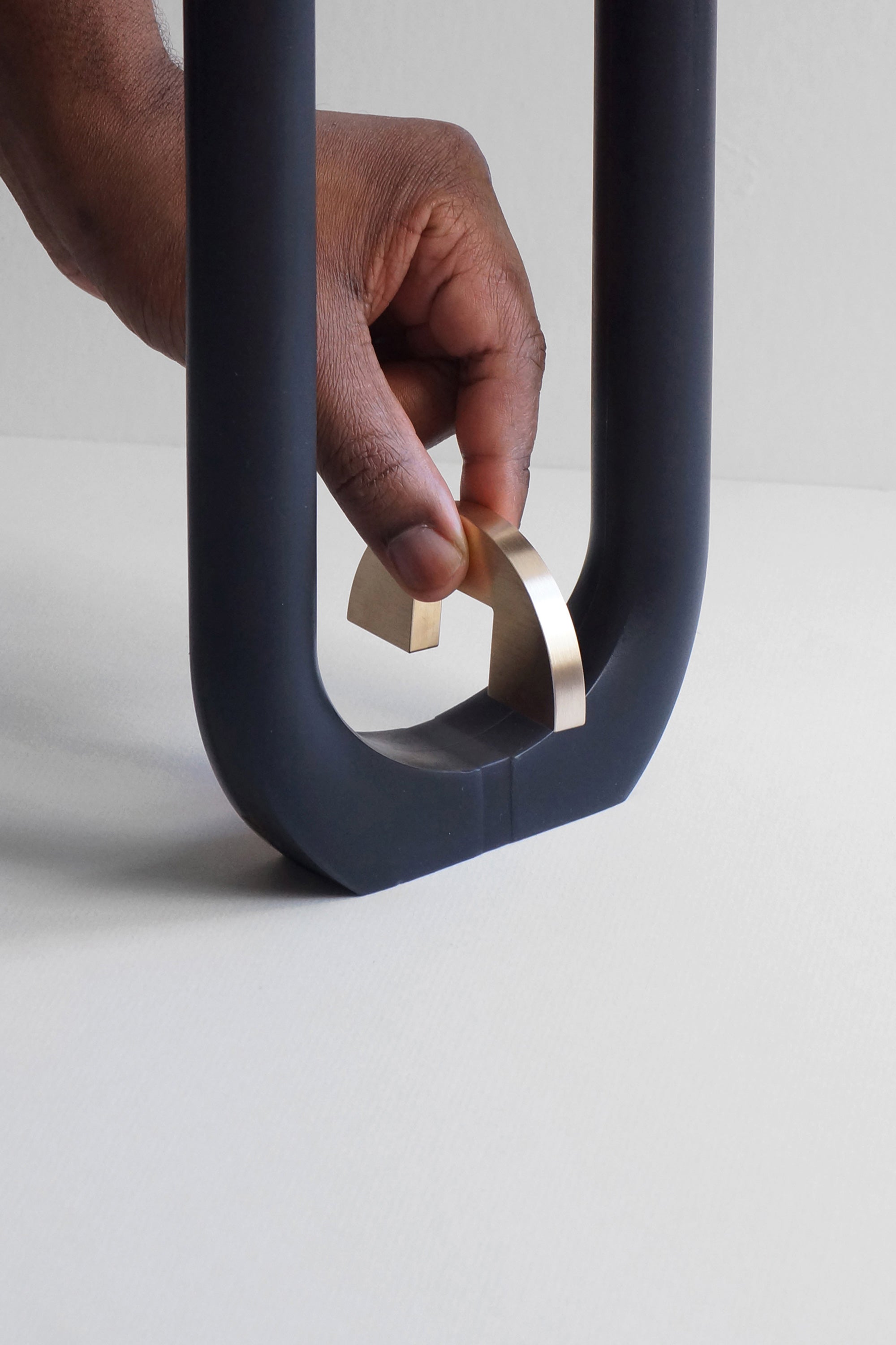 black u candle with brass holder